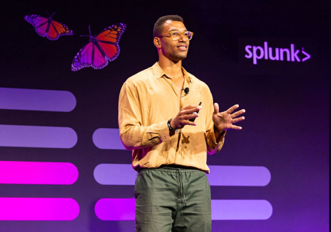 A Splunk leader speaking on-stage at an event.