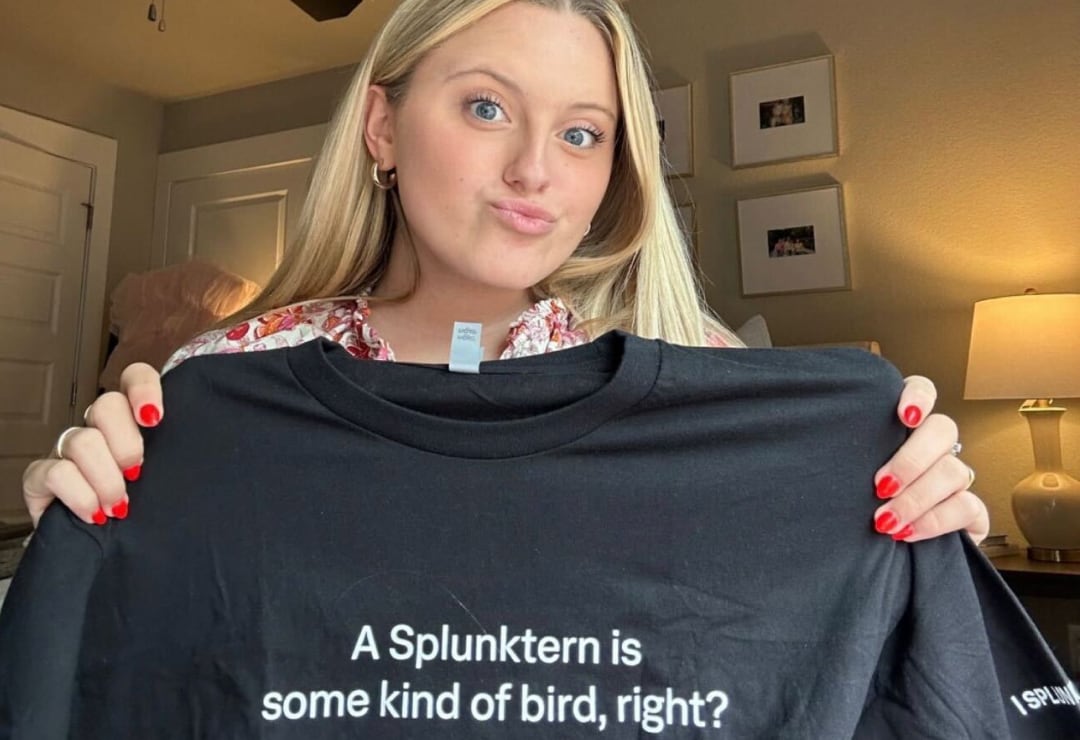 A Splunktern holds a t-shirt with writing that says, “A Splunktern is some kind of a bird, right?”
