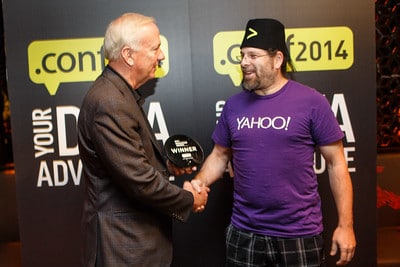 Godfrey shakes the hand of Sagi Zelnick, principal architect with Yahoo!, congratulates Sagi for his Revolution Award in the Big Data Category.