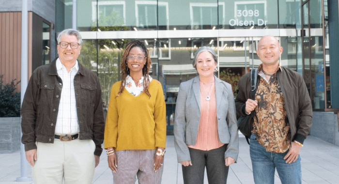 Four Splunkers stand together in front of our San Jose office.