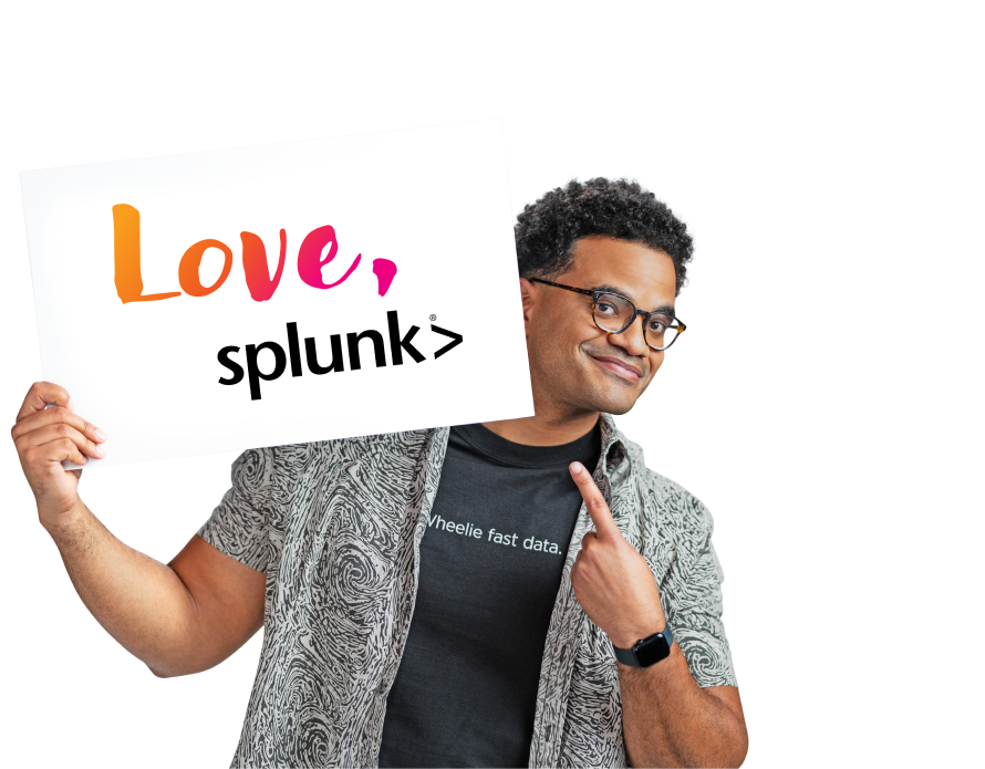 A smiling Splunker points to a card that says, “Love, Splunk.”