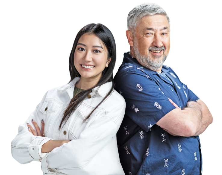 Two Splunkers smiling confidently, back to back, with their arms crossed.