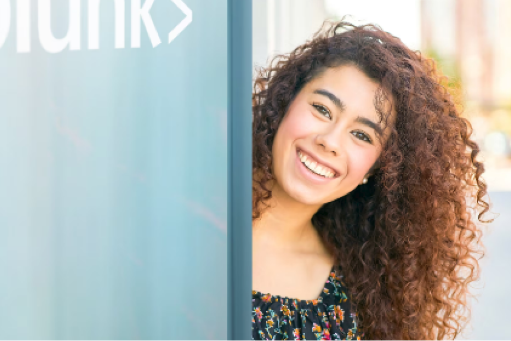  A Splunker working from Costa Rica beams as she opens the door to the company office in San José. 