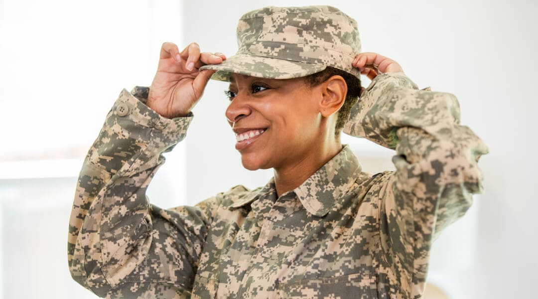 A service member dressed in fatigues. We value the unique experiences and contributions of service members and veterans like this one. 