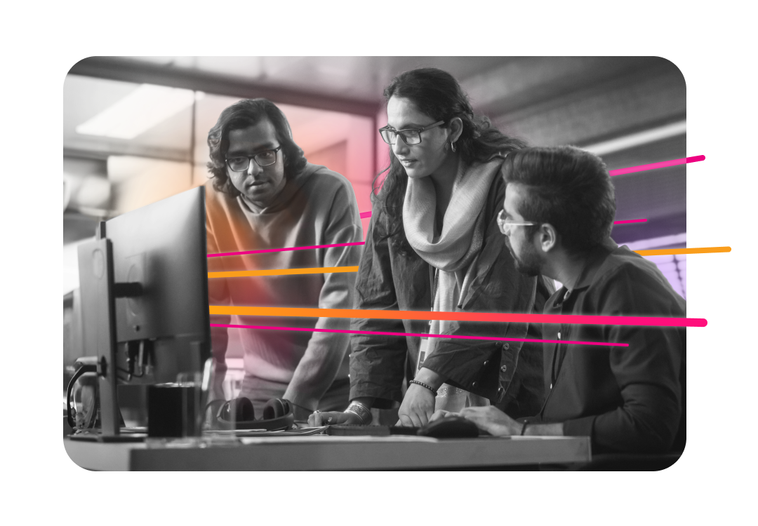 A group of coworkers having a discussion in an office building