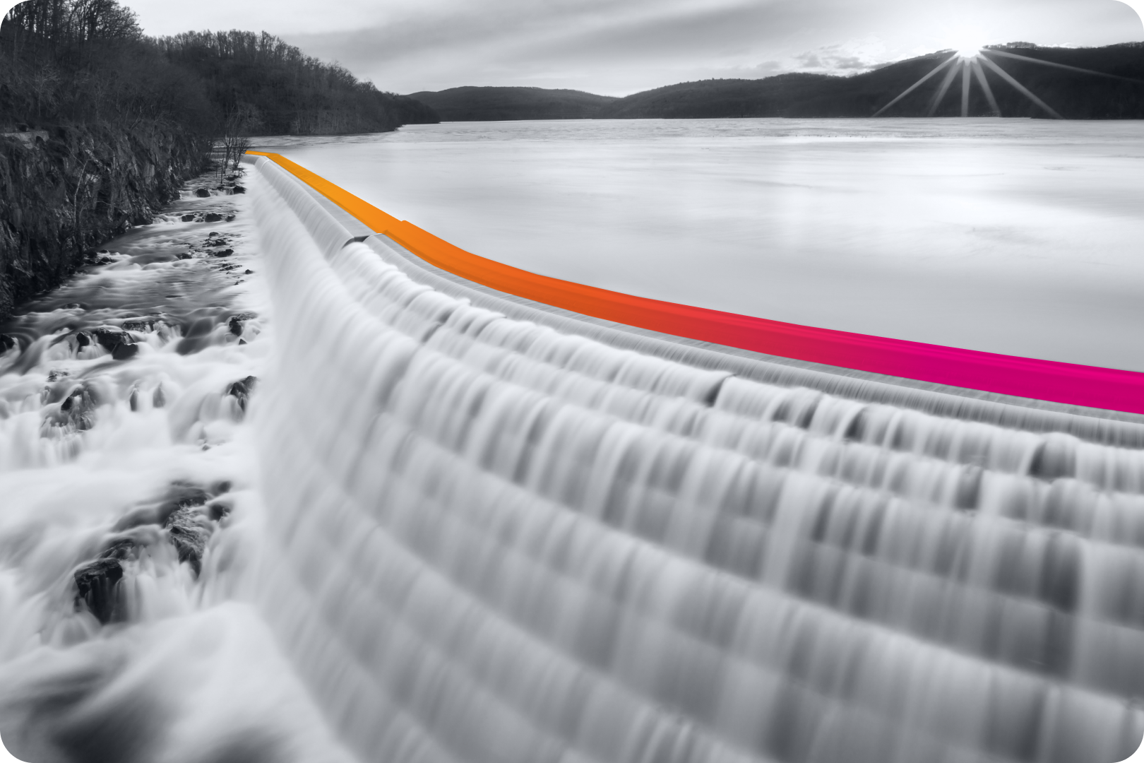 A black and white image of a waterfall with a gradient border line following the overhang. 