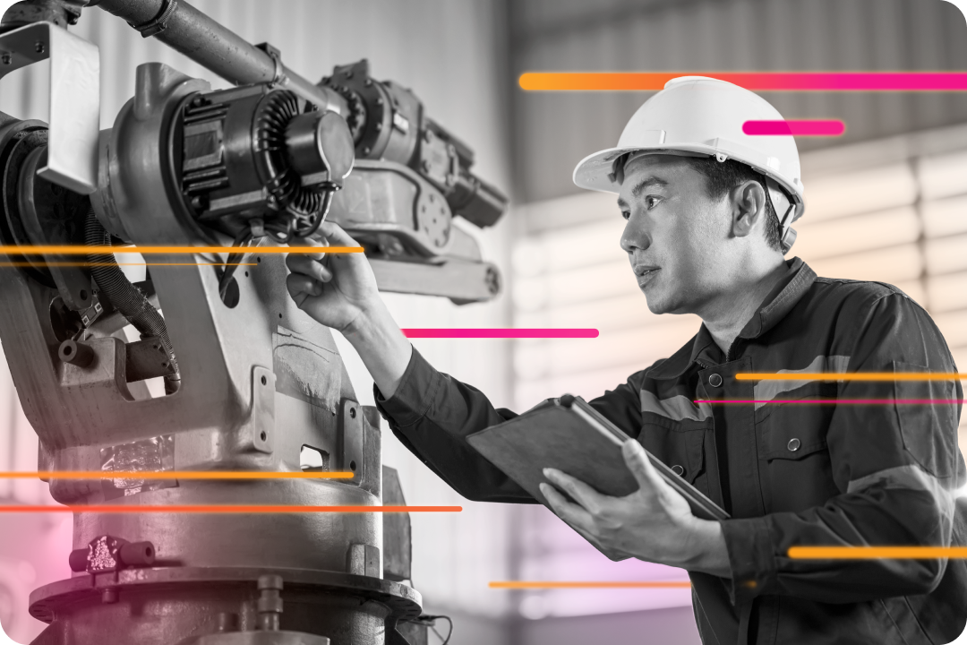 man in hard hat using manufacturing equipment